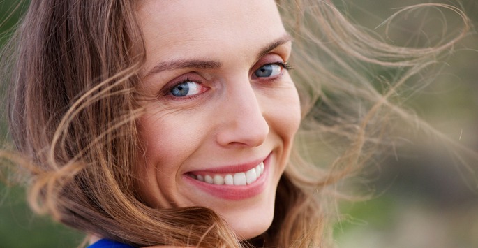 a close-up photo of a blonde woman's face