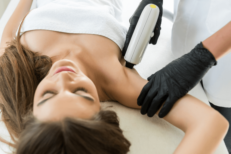 a photo of a woman getting laser hair removal on her armpit