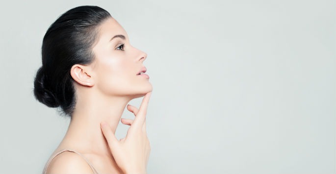 a photo of a brunette woman's profile