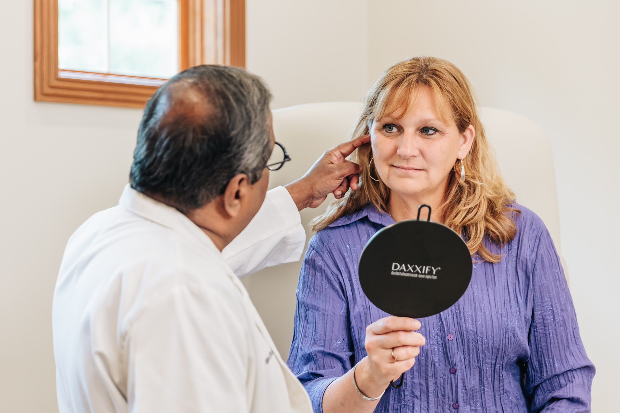 A provider and a patient discuss Facial Contouring in Portage