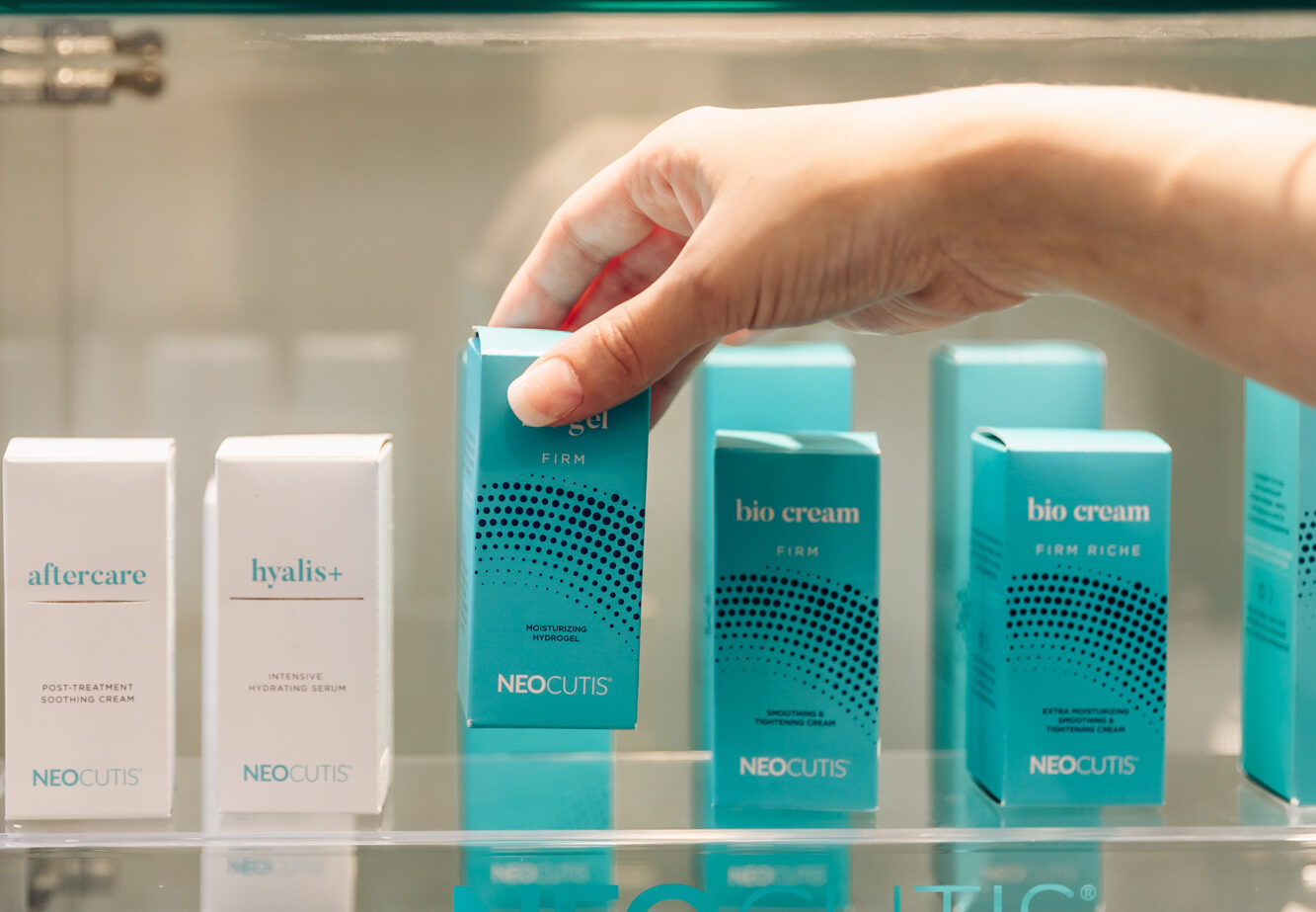 A patient examines our skin products at our skin clinic near Kalamazoo.