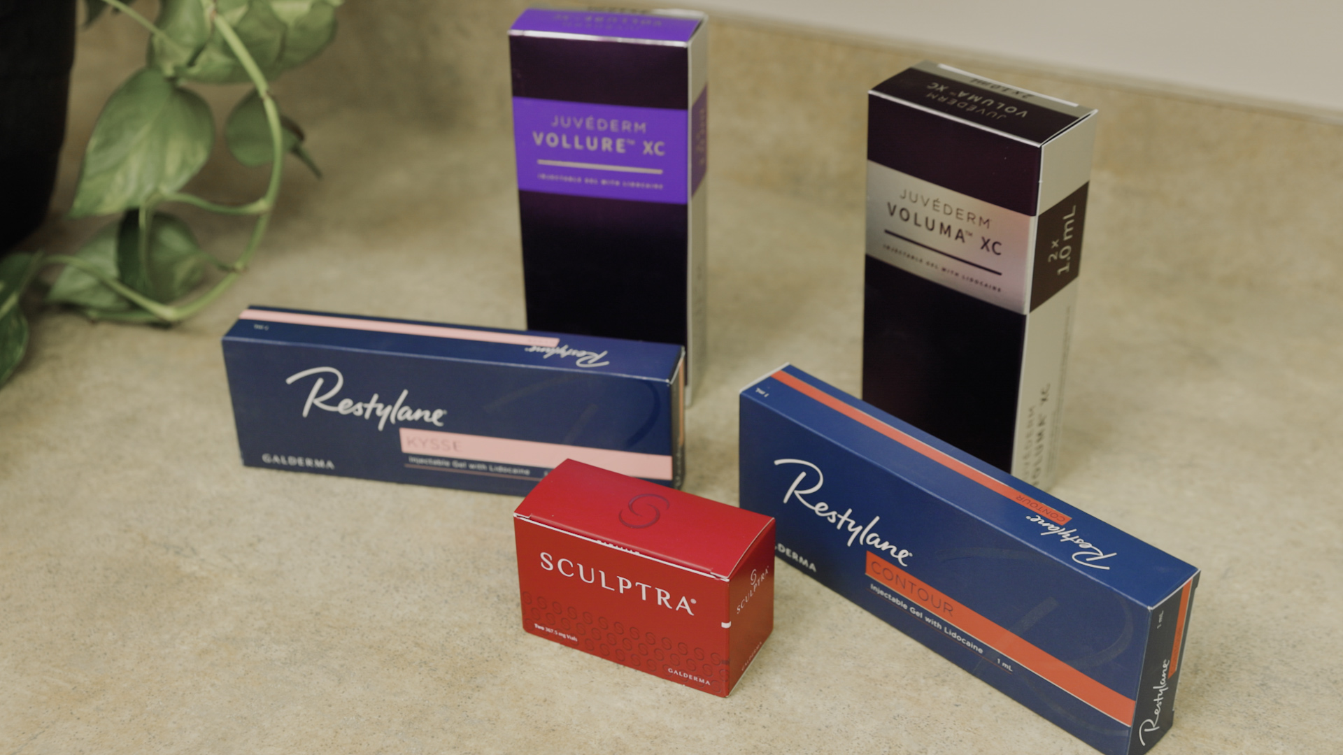 A close-up photo of several boxes of dermal filler, which we use during our anti-aging treatments in Portage.