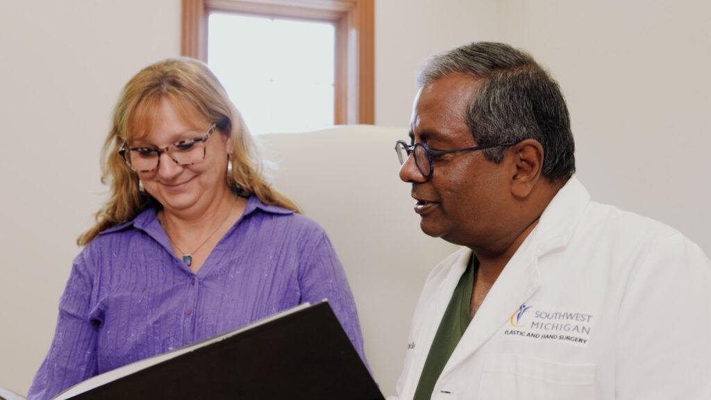 A provider and a patient smile and discuss facials near Kalamazoo.